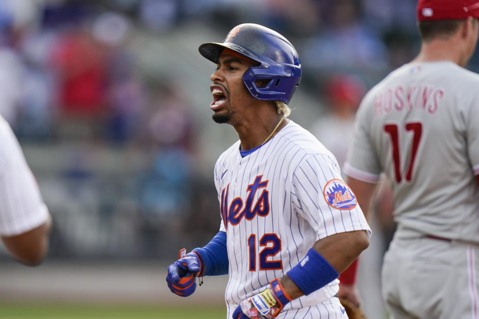 New York Mets' Francisco Lindor celebrates after hitting an RBI-single to tie during the seventh inning of the first baseball game of a doubleheader against the Philadelphia Phillies, Friday, June 25, 2021, in New York. (AP Photo/Frank Franklin II)