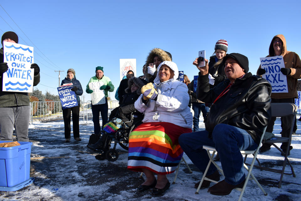 FILE - In this Oct. 29, 2019 file photo, opponents of the Keystone XL oil pipeline from Canada demonstrate in sub-freezing temperatures in Billings, Mont. Alberta is investing $1.1 billion in the disputed Keystone XL pipeline, a project that Alberta Premier Jason Kenney says is crucial for the province's economy. (AP Photo/Matthew Brown, File)