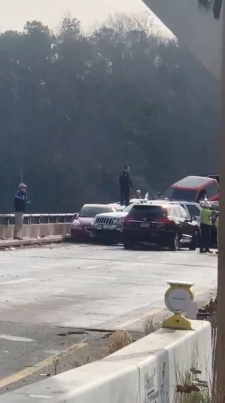 Damaged vehicles are seen after a chain reaction crash on I-64 in York County, Virginia