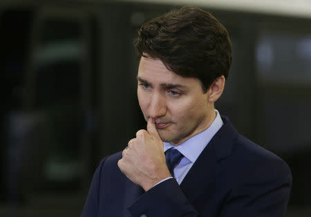 Canada's Prime Minister Justin Trudeau pauses during a visit to the Winnipeg Transit Fort Rouge Garage to make a transit infrastructure announcement in Winnipeg, Manitoba, Canada, February 12, 2019. REUTERS/Shannon VanRaes