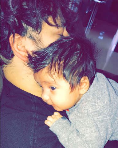 <p>Rob Kardashian/Instagram</p> Rob Kardashian holding baby Dream