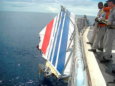 FILE PHOTO: Brazilian Navy picks a piece of debris from Air France flight AF447 out of the Atlantic Ocean, some 745 miles (1,200 km) northeast of Recife