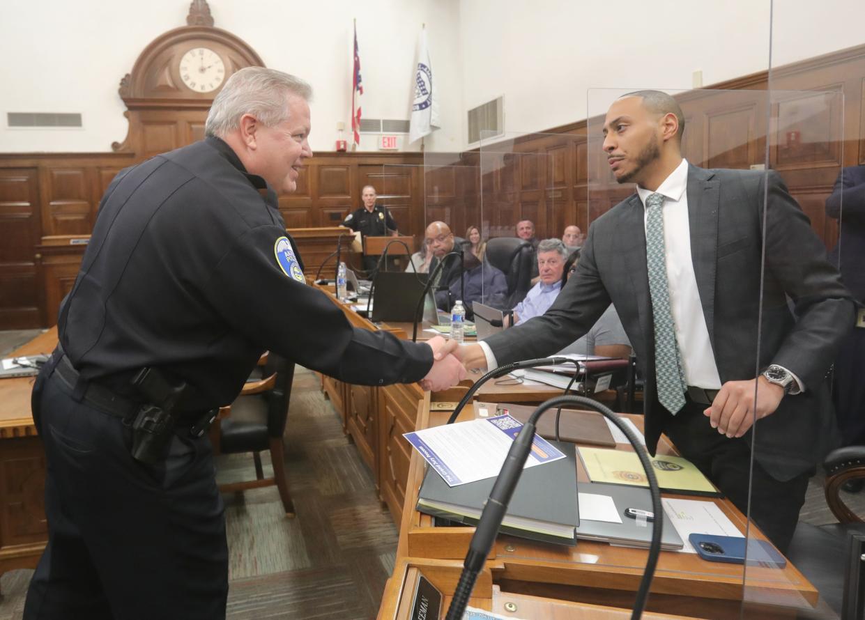 Akron Police Chief Steve Mylett introduces himself to Citizens' Police Oversight Board member Brandyn Costa before the group's first meeting Friday in City Council chambers.