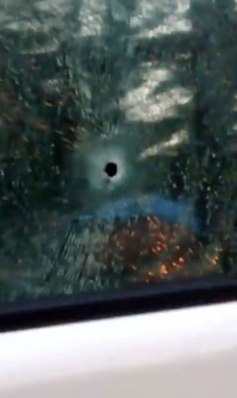 A bullet hole is seen on the window of a car after a shooting rampage in the city of Nakhon Ratchasima