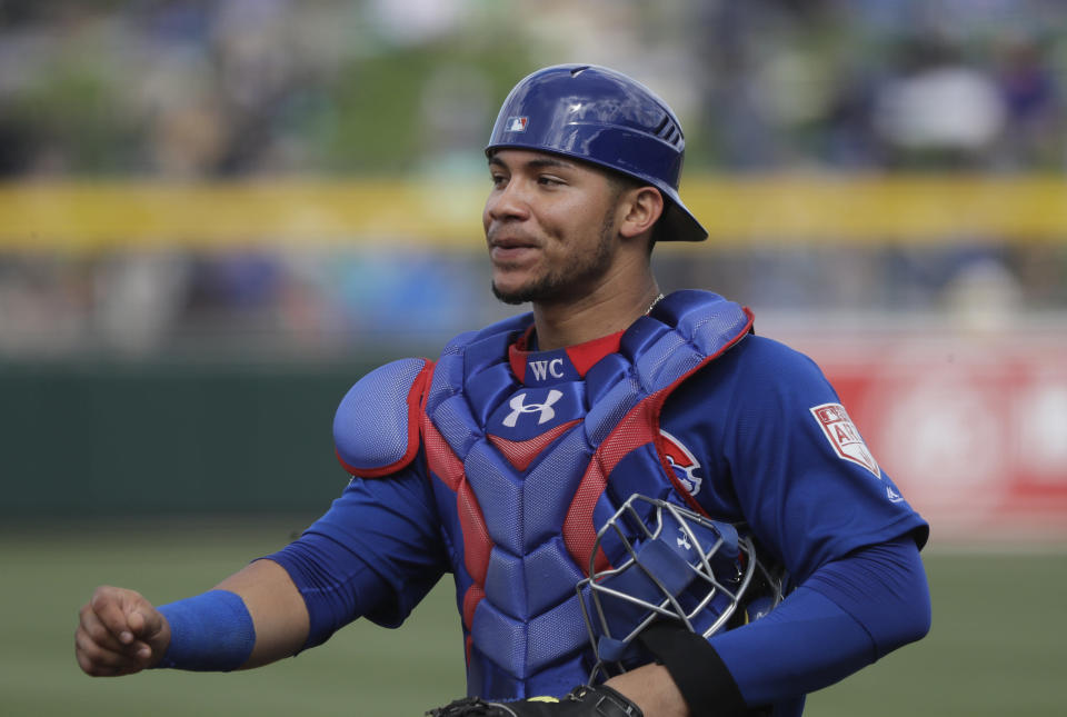 Chicago Cubs catcher Willson Contreras walks back to the plate against the Oakland Athletics in a spring training baseball game Wednesday, March 13, 2019, in Mesa, Ariz. (AP Photo/Elaine Thompson)