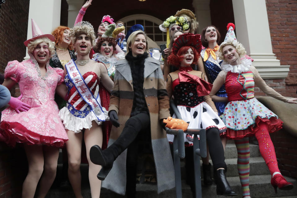 Actor and director Elizabeth Banks, center, kicks her leg up with student actors in drag as she is honored as the 2020 Woman of the Year by Harvard University's Hasty Pudding Theatricals, Friday, Jan. 31, 2020, in Cambridge, Mass. (AP Photo/Elise Amendola)