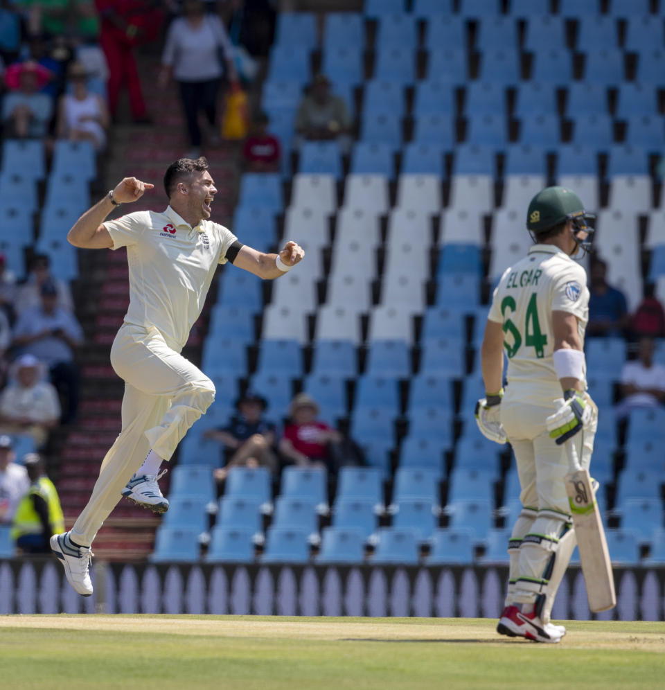 England's bowler James Anderson, left, jumps as he celebrates after dismissing South Africa's Dean Elgar for a duck on day one of the first cricket test match between South Africa and England at Centurion Park, Pretoria, South Africa, Thursday, Dec. 26, 2019. (AP Photo/Themba Hadebe)