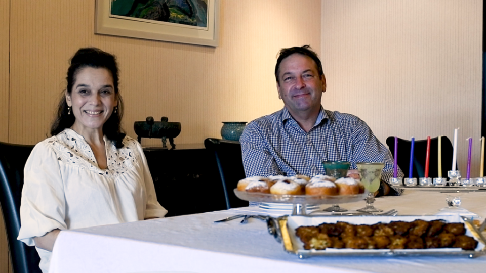 Israeli Representative Omer Caspi, right, and his wife, Galit Cohen Caspi share the preparations made ahead of this year’s Hanukkah. (Dimitri Bruyas)