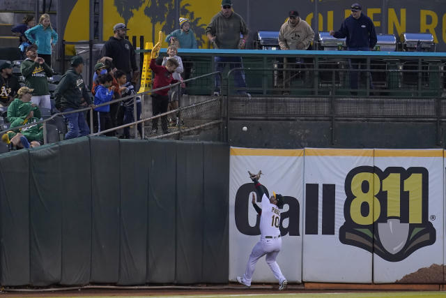 Oakland Athletics left fielder Chad Pinder catches a fly ball hit by Boston Red Sox's Franchy Cordero during the sixth inning of a baseball game in Oakland, Calif., Friday, June 3, 2022. (AP Photo/Jeff Chiu)