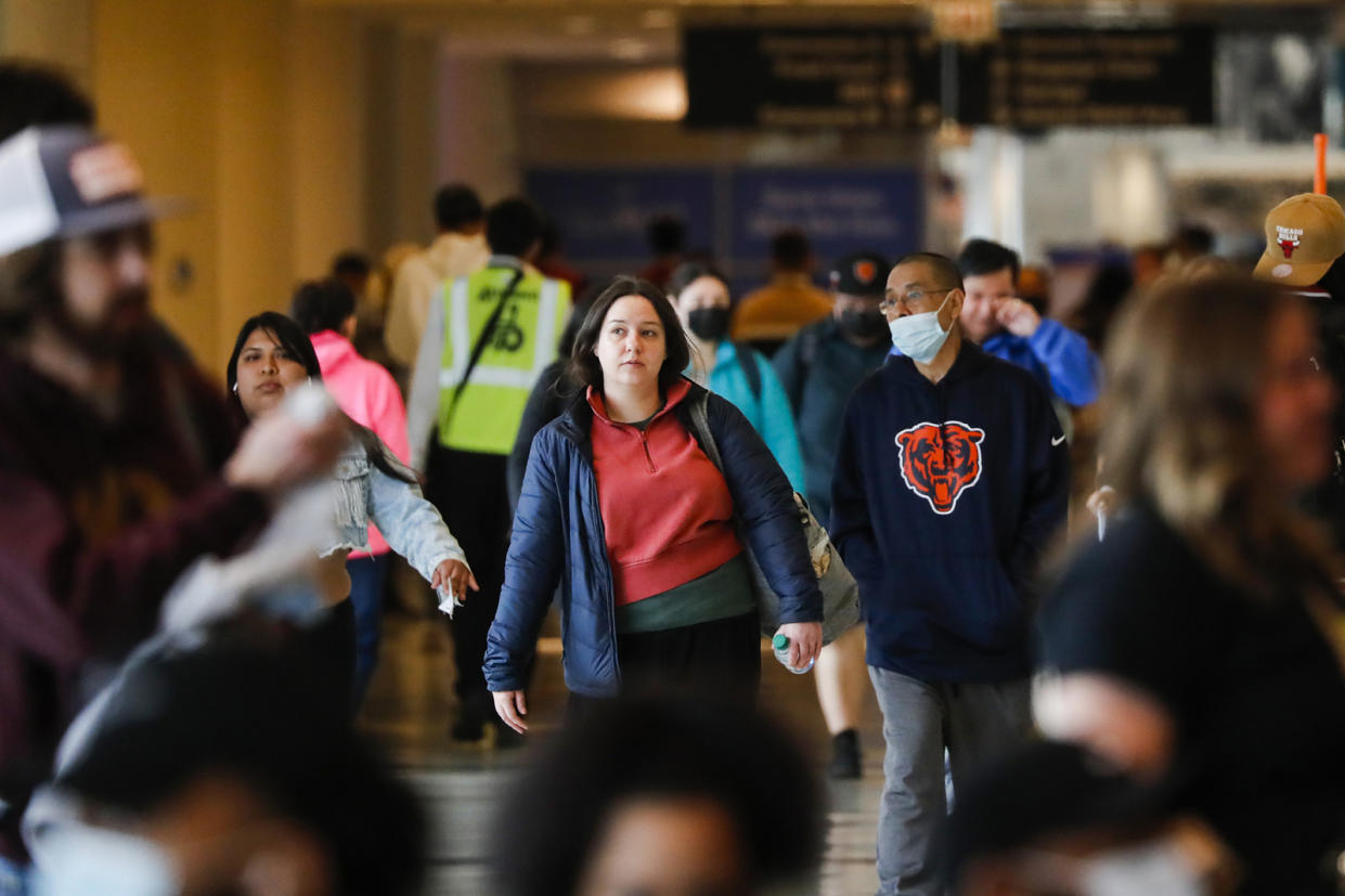 Travelers walk through Midway Airport in Chicago on April 28, 2022. (Jose M. Osorio/Chicago Tribune/Tribune News Service via Getty Images)