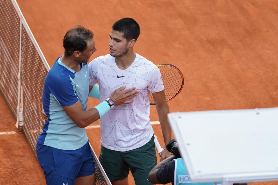 Rafa Nadal (pictured left) shakes hands with Carlos Alcaraz (pictured right).