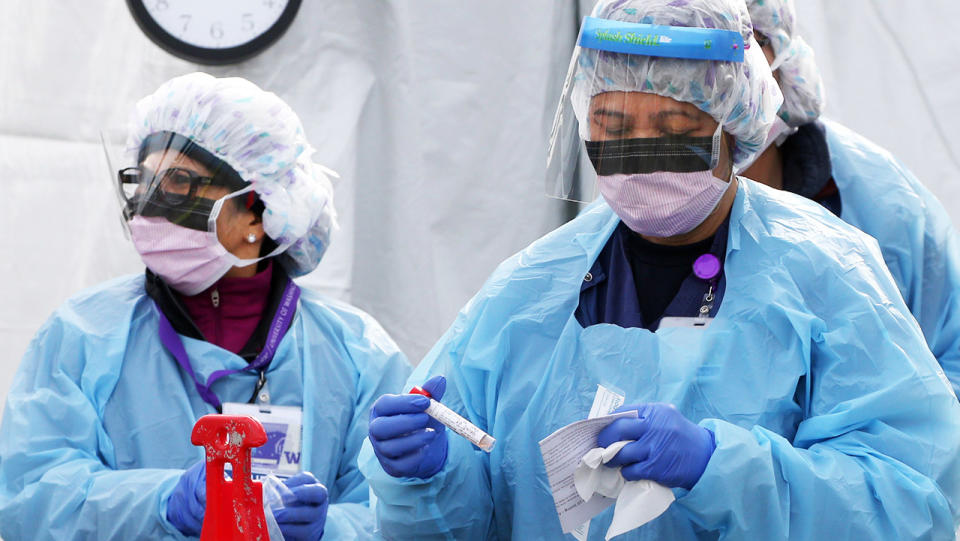 Nurses, pictured here processing a sample for COVID-19 at the University of Washington Medical Centre.