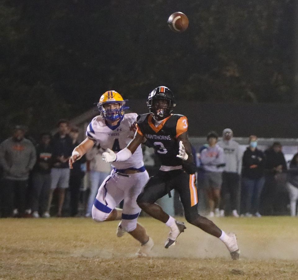 Hawthorne High's Anthony Morgan (3) eyes the ball to make an interception Friday against Chipley.