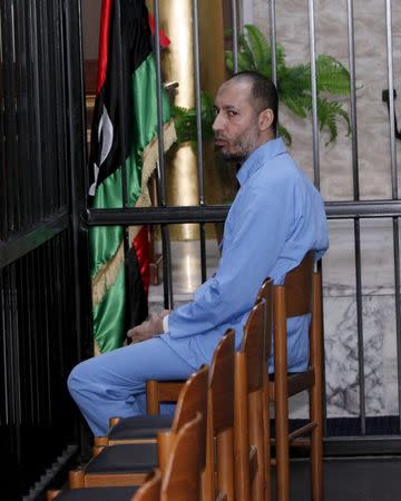 Saadi Gaddafi, son of Muammar Gaddafi, sits behind bars during a hearing at a courtroom in Tripoli, Libya November 1, 2015. REUTERS/Ismail Zitouny