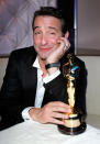 Best Actor winner, Jean Dujardin ("The Artist"), looked sleepy, happy, and quite possibly buzzed next to his new trophy.