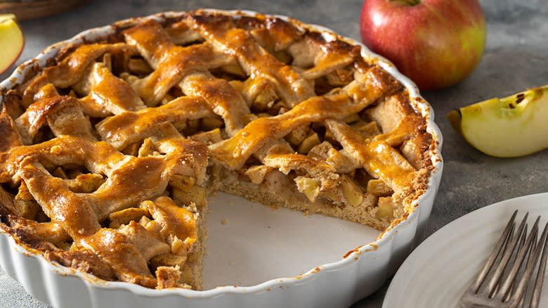 Latticed apple pie in pan