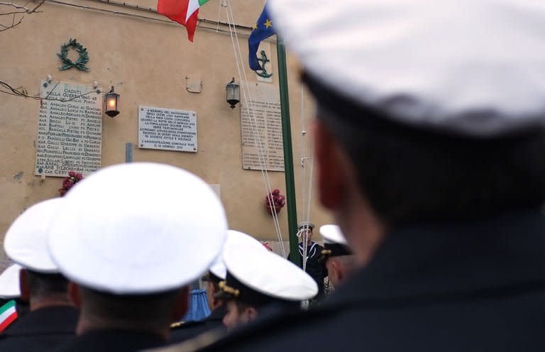 Sailors attend the Costa Concordia shipwreck's first anniversary, on January 13, 2013 on the Italian island of Giglio