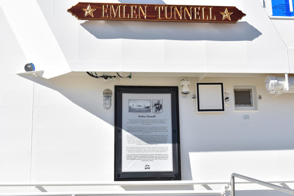 This undated photo provided by the United States Coast Guard shows a name plate and tribute plaque for Emlen Tunnell on a U.S. Coast Guard cutter docked in Bollinger Shipyard, Lockport, La. Tunnell, the first Black athlete inducted into the Pro Football Hall of Fame, served in the Coast Guard during and after World War II, where he was credited with saving the lives of two shipmates in separate incidents. Now, a Coast Guard cutter and an athletic building on the Coast Guard Academy campus are being named in honor of the former New York Giants defensive back. (United States Coast Guard via AP)