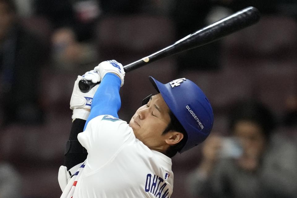 Los Angeles Dodgers' designated hitter Shohei Ohtani swings during the first inning of the exhibition game between the Los Angeles Dodgers and Kiwoom Heroes at the Gocheok Sky Dome in Seoul, South Korea, Sunday, March 17, 2024. The Los Angeles Dodgers and the San Diego Padres will meet in a two-game series on March 20th-21st in Seoul for the MLB World Tour Seoul Series. (AP Photo/Lee Jin-man)