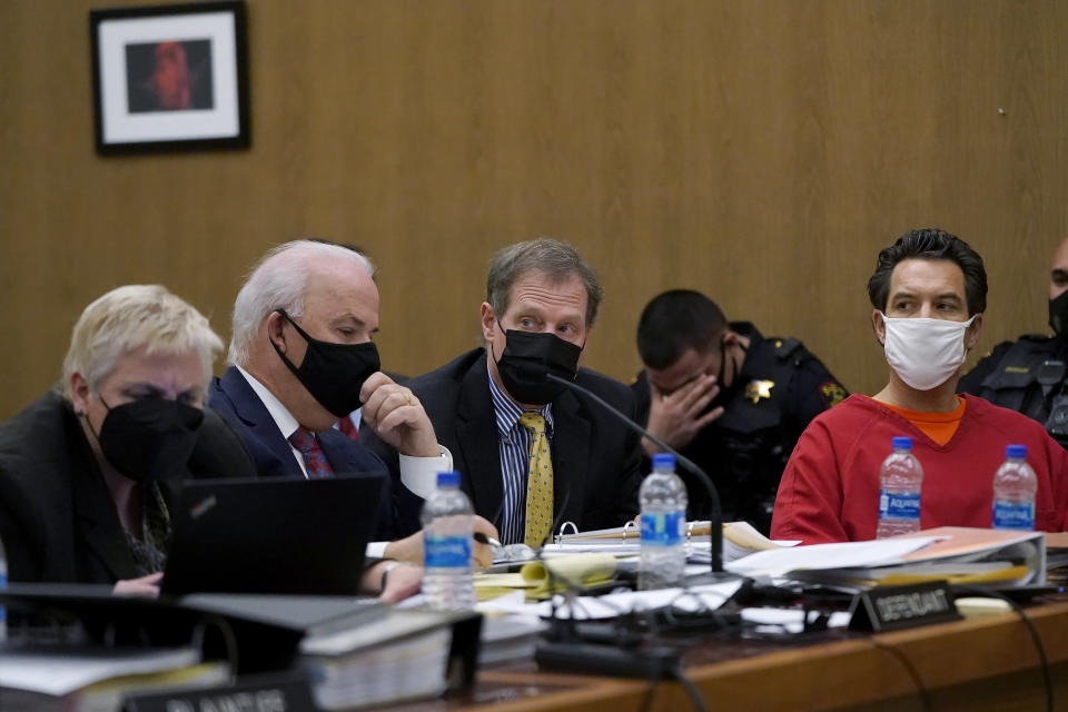 Scott Peterson, right, sits with his attorneys Shelley Sandusky, Pat Harris and Cliff Gardner, from left, during a hearing at San Mateo County Superior Court in Redwood City, Calif., Monday, Feb. 28, 2022. Lawyers trying to overturn Peterson’s conviction in the sordid slaying of his pregnant wife 20 years ago completed their questioning Monday without shaking a former juror from her crucial testimony that she acted properly before and during his 2004 trial. (AP Photo/Jeff Chiu, Pool)