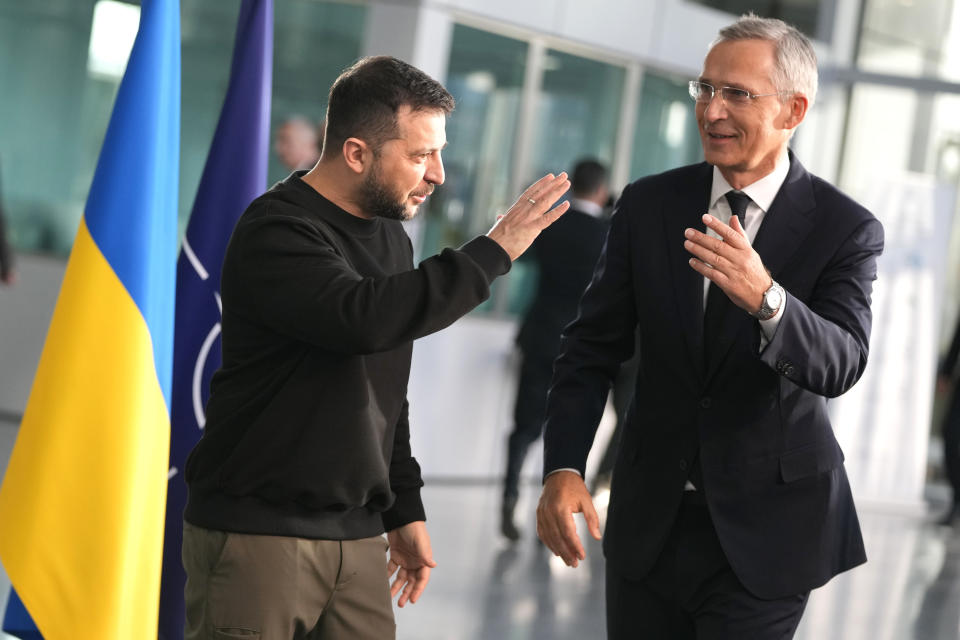 Ukraine's President Volodymyr Zelenskyy, left, speaks with NATO Secretary General Jens Stoltenberg prior to a meeting of NATO defense ministers at NATO headquarters in Brussels, Wednesday, Oct. 11, 2023. (AP Photo/Virginia Mayo)