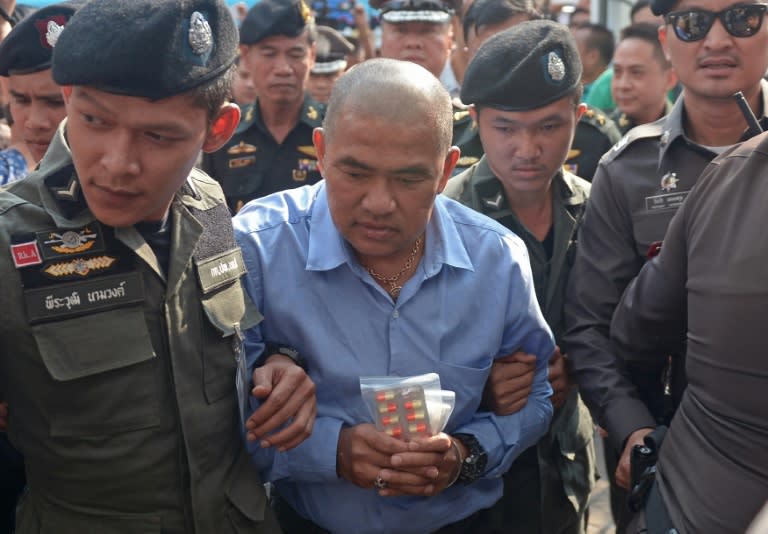 Thai fortune teller Suriyan Sucharitpolwong, also known as "Mor Yong", faced a military court in Bangkok on October 21, 2015, but has since died in custody