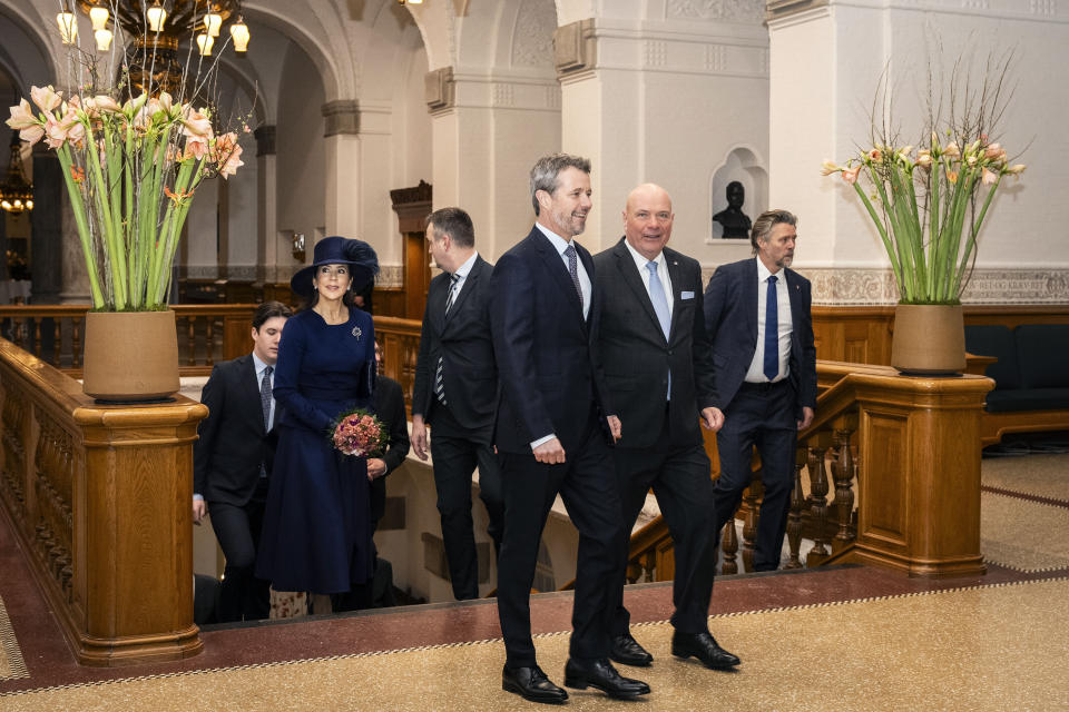 Denmark's King Frederik X, foreground left, Queen Mary, background left and Crown Prince Christian,arrive with Speaker of the Folketing Soeren Gade, right, at the Folketingsalen at Christiansborg Palace in Copenhagen, Monday, Jan. 15, 2024, their first time visiting in their new official roles. (Emil Nicolai Helms/Ritzau Scanpix via AP)