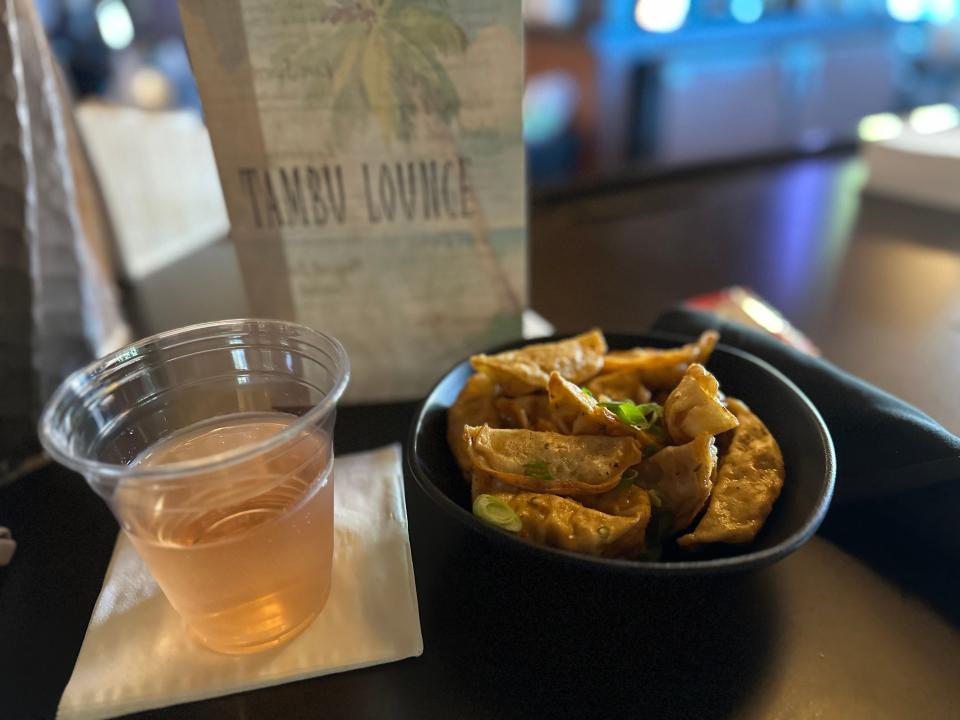 Food and a beverage from the Tambu Lounge.