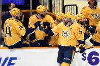 Nashville Predators defenseman Roman Josi (59) is congratulated after scoring a goal against the Tampa Bay Lightning during the first period of an NHL hockey game Tuesday, April 13, 2021, in Nashville, Tenn. (AP Photo/Mark Zaleski)