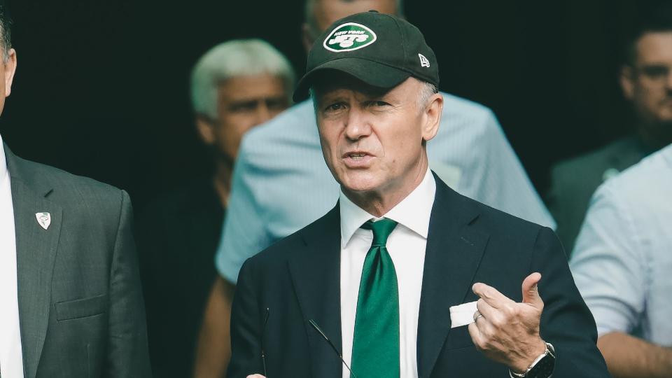 New York Jets owner Woody Johnson, center walks out onto the field during practice before an NFL football game, in Miami Gardens, FlaJets Dolphins Football, Miami Gardens, USA - 03 Nov 2019.