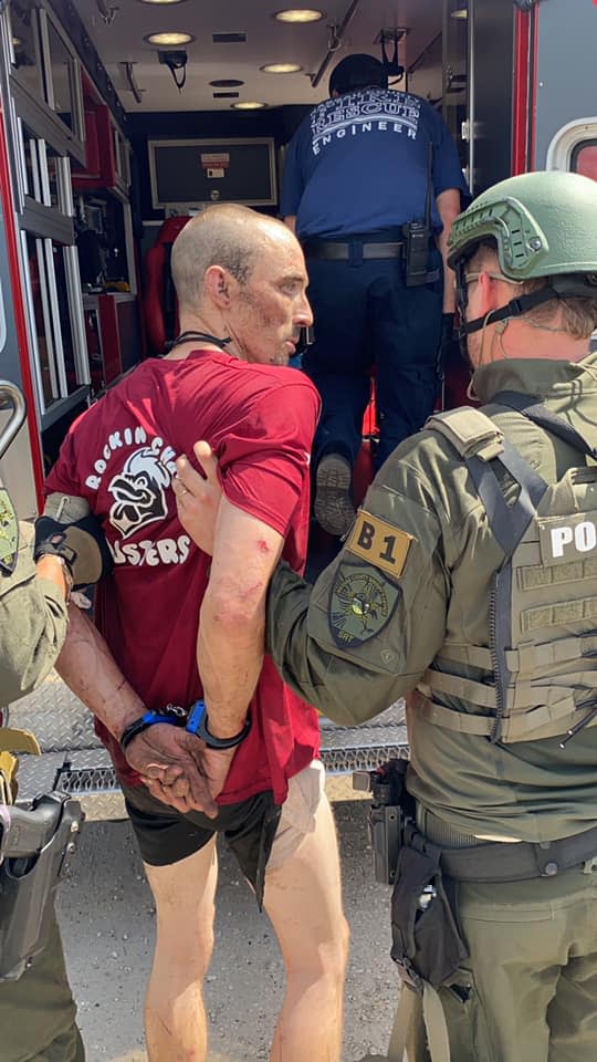 Secured using the late Deputy Joshua Moyers&#39; own handcuffs, suspect Patrick McDowell is loaded into a rescue unit Sept. 28 in Callahan after his arrest.