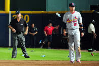 Umpire Rob Drake reacts after bottles and cups are thrown on the field by fans after the home fans disagree with an infield fly ruling on a ball hit by Andrelton Simmons #19 of the Atlanta Braves in the eighth inning while taking on the St. Louis Cardinals during the National League Wild Card playoff game at Turner Field on October 5, 2012 in Atlanta, Georgia. (Photo by Scott Cunningham/Getty Images)