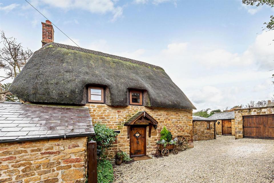 <p>In the heart of Banbury, Oxfordshire, this charming thatched Grade II Listed cottage ticks all the right boxes. Some of the standout features include vaulted ceilings, period style bathrooms, underfloor heating, and an inglenook fireplace. When can we move in? </p><p><a href="https://www.zoopla.co.uk/for-sale/details/57482340" rel="nofollow noopener" target="_blank" data-ylk="slk:This property is currently on the market for £440,000 with Fine & Country via Zoopla;elm:context_link;itc:0;sec:content-canvas" class="link ">This property is currently on the market for £440,000 with Fine & Country via Zoopla</a>. </p>