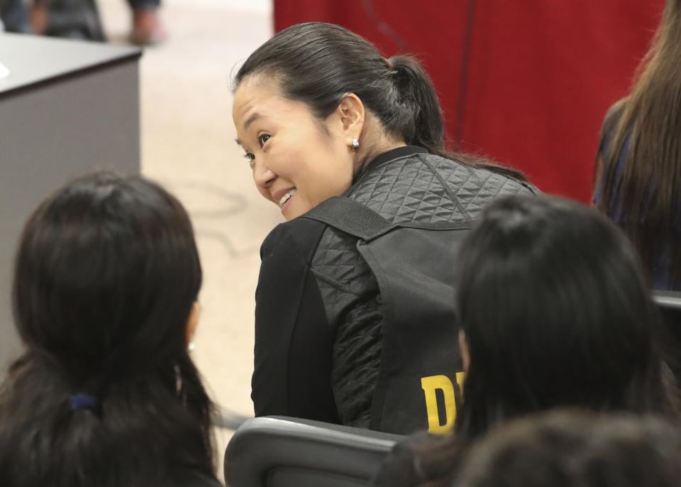 Keiko Fujimori, the daughter of Peru's former President Alberto Fujimori, and leader of the opposition party, attends a hearing to appeal her detention in Lima, Peru, Wednesday, Oct. 17, 2018. An appeals judge has freed Keiko Fujimori a week after she was arrested during a money laundering investigation. (AP Photo/Martin Mejia)