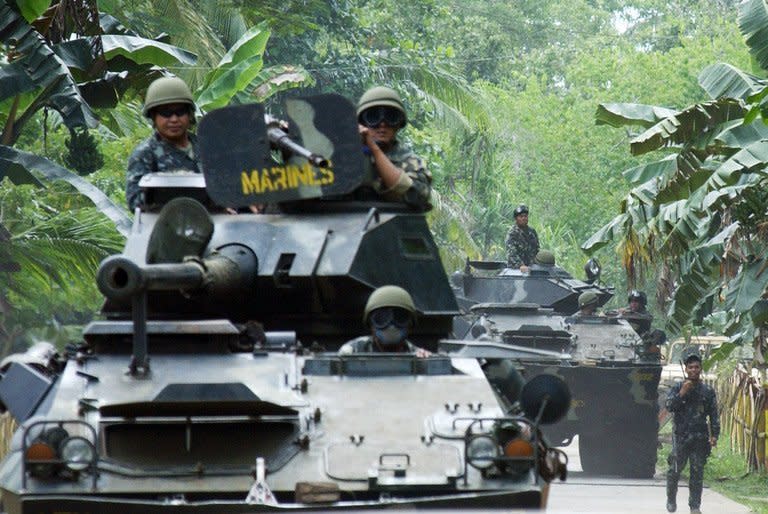 Philippine Marines armored vehicles are deployed in Patikul in southern Jolo island, on September 14, 2006, as part of massive military operations hunting al-Qaeda linked Abu Sayyaf and Jemaah Islamiyah (JI) militants
