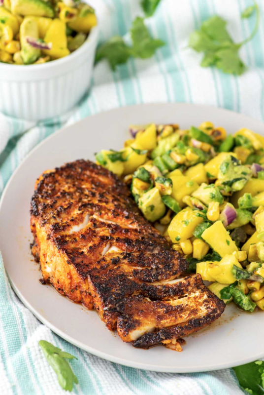 <p>Chisel and Fork</p><p>This blackened cod with a fresh corn mango salsa is loaded with flavor and can be prepared in under 10 minutes.</p><p><strong>Get the recipe: <a href="https://www.chiselandfork.com/blackened-cod/" rel="nofollow noopener" target="_blank" data-ylk="slk:Blackened Cod with Fresh Corn Mango Salsa;elm:context_link;itc:0;sec:content-canvas" class="link rapid-noclick-resp"><em>Blackened Cod with Fresh Corn Mango Salsa</em></a></strong></p>