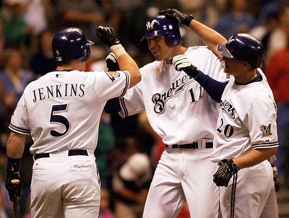 Milwaukee Brewers' Richie Sexson (11) is congratlated by Geoff Jenkins (5) and Jeromy Burnitz after hitting a two-run home run in 2001.