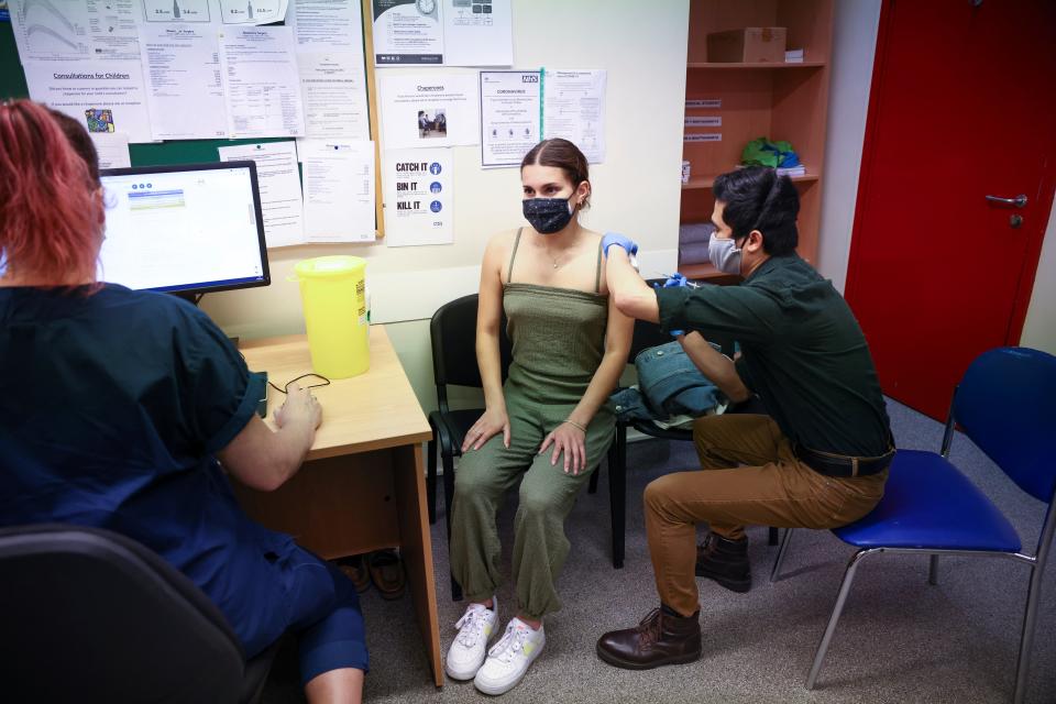 A person receives a dose of the Pfizer BioNTech jab at a vaccination centre for young people and students in London (REUTERS)