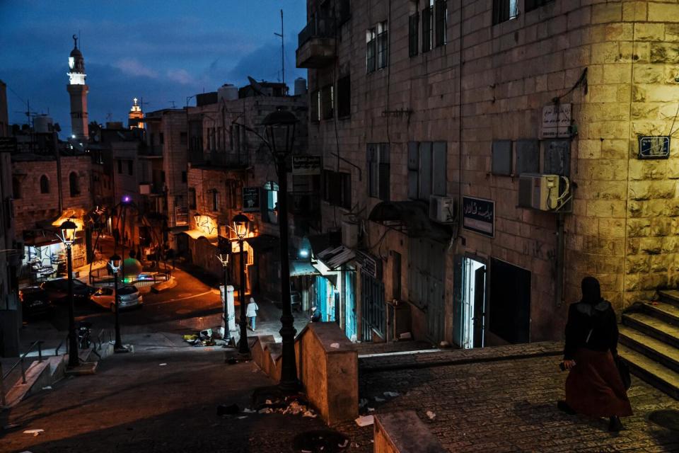 People walk through the Old City in Bethlehem, West Bank.