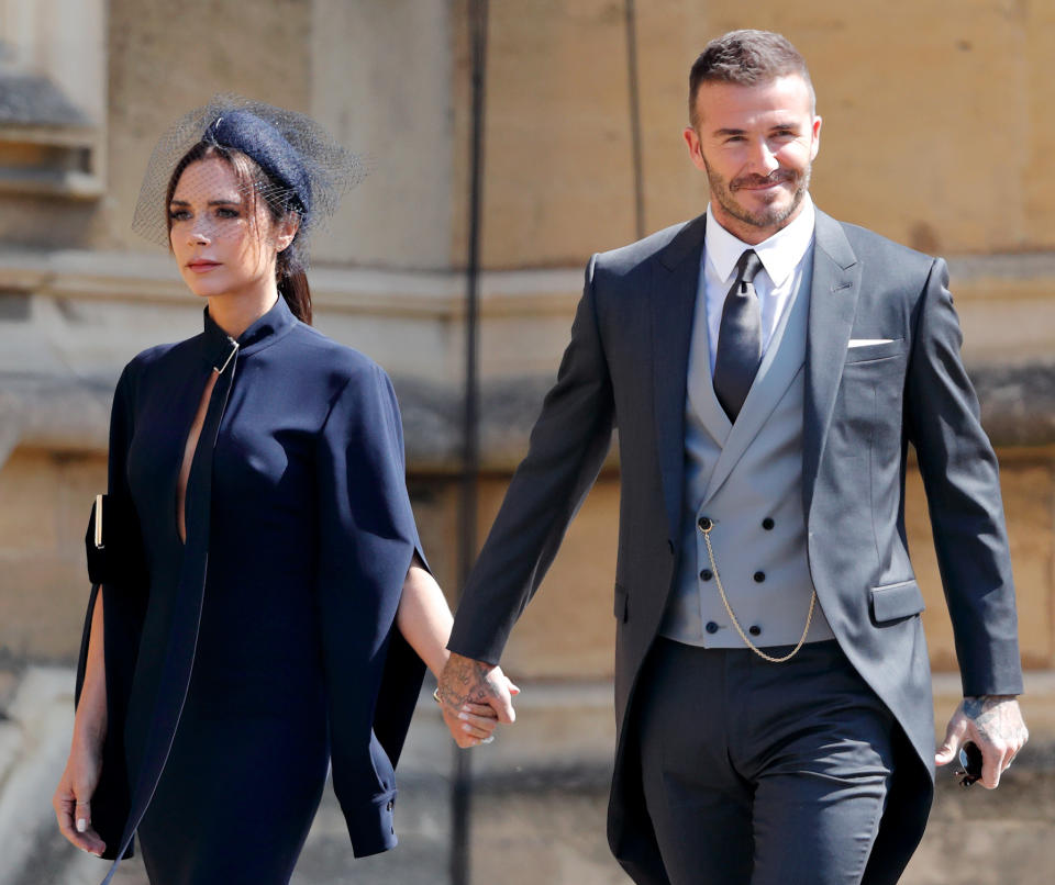 Victoria and David Beckham, attending Prince Harry and Meghan Markle’s wedding on May 19, celebrated their 19th wedding anniversary together amid divorce gossip. (Photo: Max Mumby/Indigo/Getty Images)