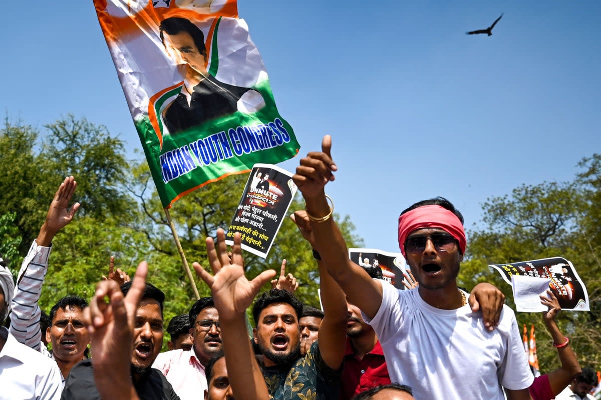 India’s Congress party activists and supporters protest against conviction of Congress party leader Rahul Gandhi in a criminal defamation case, in New Delhi on 27 March 2023 (AFP/Getty)