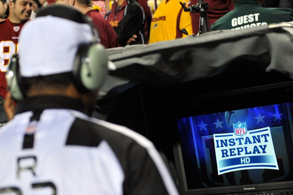 Referee Jerome Boger #23 looks into the replay booth on a challenge call in the first quarter in the game between the Washington Redskins and the New York Giants at FedExField on December 3, 2012 in Landover, Maryland. (Photo by Patrick McDermott/Getty Images)