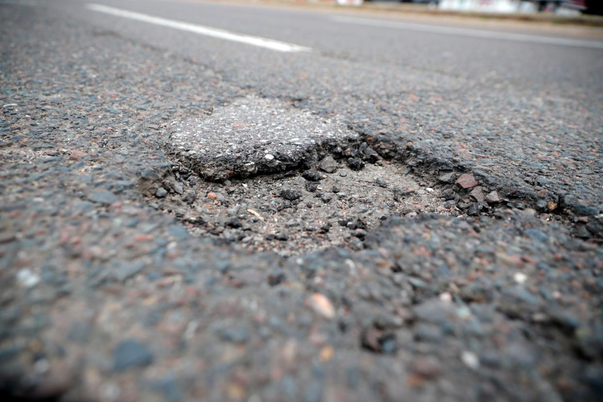 A pothole is pictured. The city of Piedmont has canceled plans that would have invited residents to help patch their own "pesky" potholes this Saturday with a little training and free materials.