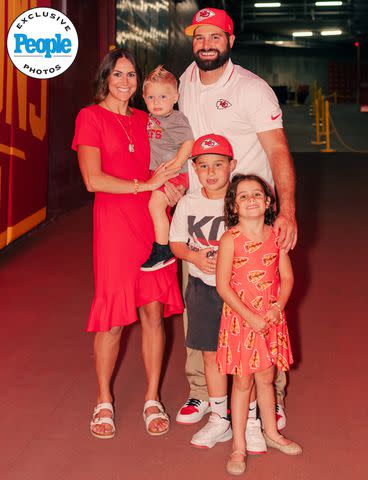 <p>Courtesy of Abby Lynne Photo</p> Porter Ellett and his wife Carlie pose with their three kids at Arrowhead Stadium, home of the Kansas City Chiefs football team.