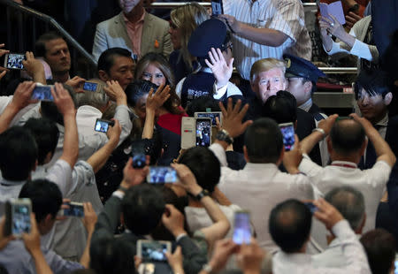 U.S. President Donald Trump and first lady Melania Trump arrive at the Summer Grand Sumo Tournament at Ryogoku Kokigikan Sumo Hall in Tokyo, Japan May 26, 2019. REUTERS/Jonathan Ernst