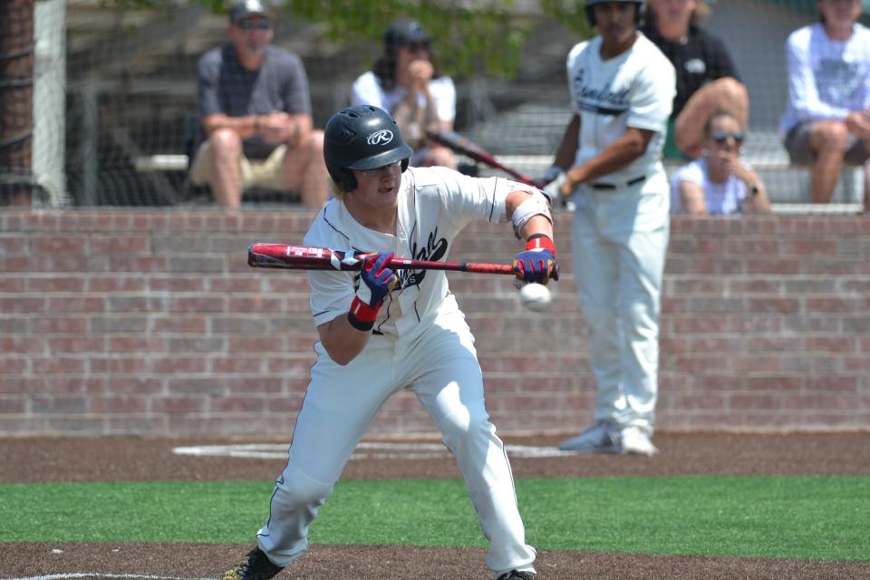 Randall junior Payton Bush attempts a bunt in the Class 5A bi-district round win over Monterey at Randall High School on May 7, 2022.