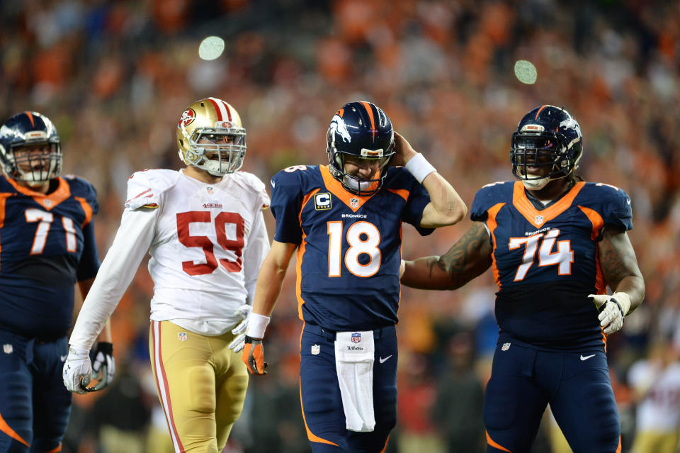 Denver Broncos guard Orlando Franklin, right, congratulates Peyton Manning on his touchdown pass. (USA Today Sports)