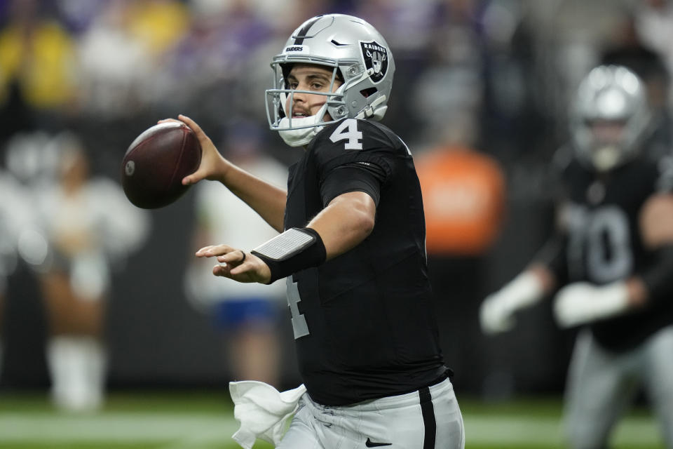 Las Vegas Raiders quarterback Aidan O'Connell (4) throws against the Minnesota Vikings during the first half of an NFL football game, Sunday, Dec. 10, 2023, in Las Vegas. (AP Photo/John Locher)