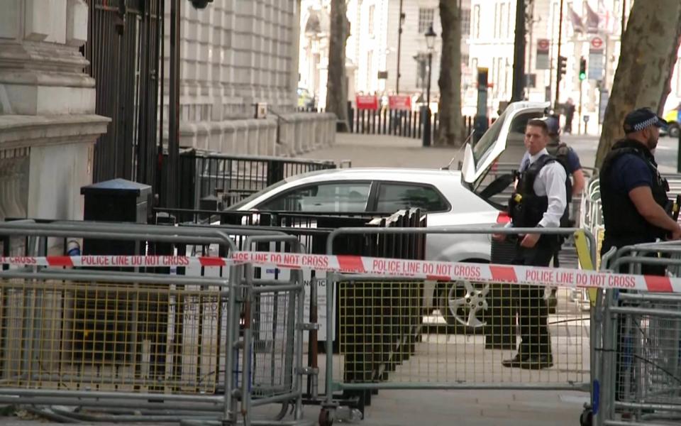 The car was surrounded by armed police after the incident - UNPIXS