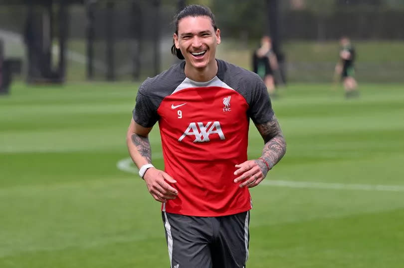 Darwin Nunez is seen smiling during Liverpool training at the AXA Training Centre